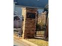 Highwood Park community entrance with brick columns and decorative gate, showing secure community access at 4155 Park Chase Dr, Atlanta, GA 30344