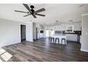 Spacious open-concept living and kitchen area features stainless appliances, updated cabinets, and island with bar seating at 2811 Birchwood Sw Ct, Marietta, GA 30060