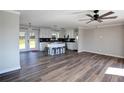Bright open-concept living and kitchen area features modern cabinets and new flooring at 2811 Birchwood Sw Ct, Marietta, GA 30060