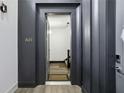 Modern entryway featuring dark trim, wood floors, and stylish unit A01 at 1200 Ponce De Leon Ne Ave # A1, Atlanta, GA 30306