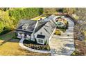 An aerial view of the house with an elongated driveway leading to backyard entertainment at 5241 Moon Rd, Powder Springs, GA 30127