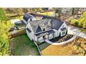 An aerial view of the house showcasing the spacious lot and landscaping at 5241 Moon Rd, Powder Springs, GA 30127