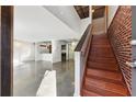 Bright and airy living room featuring an open floor plan, hardwood staircase, and modern finishes at 195 Arizona Ne Ave # 131, Atlanta, GA 30307