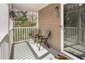 Cozy covered porch with space for chairs and a view of the outdoors at 2131 N Forest Trl, Atlanta, GA 30338