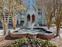 Water feature in front of building with landscaped flowers and multiple trees at 2870 Pharr Court South Nw # 1202, Atlanta, GA 30305