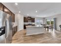 Open-concept kitchen with stainless steel appliances and an adjacent dining area at 525 Appalachian Pl, Canton, GA 30114