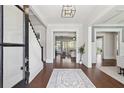 Elegant foyer with hardwood floors, staircase, and open sightlines to other rooms at 3185 Casteel Ne Rd, Marietta, GA 30062