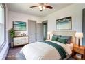Bedroom featuring a ceiling fan, neutral tones, and decoratively coordinated furniture and artwork at 1497 Rogers Sw Ave, Atlanta, GA 30310