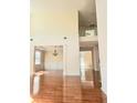 Open-concept living and dining areas with hardwood floors and modern lighting at 1172 Preserve Park Dr, Loganville, GA 30052
