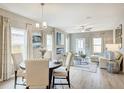 Open floor plan showcasing dining area, living room with fireplace, and stylish decor at 112 Asher Dr, Carrollton, GA 30116