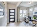 Bright office space featuring modern door, natural light, and a stylish work area at 112 Asher Dr, Carrollton, GA 30116