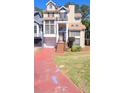 Multi-level home with driveway, attached garage, and manicured lawn; part of a residential community at 2270 Goodwood Se Blvd, Smyrna, GA 30080