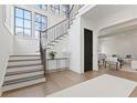 Elegant staircase features modern railings and hardwood treads, leading to the upper level at 56 Pine St, Roswell, GA 30075