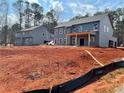 New home construction showcasing the expansive lot and modern architectural design details at 3292 Mill Forest Sw Dr, Conyers, GA 30094