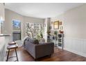 Inviting living room boasts hardwood floors, natural light, and a comfortable couch at 1 Biscayne Nw Dr # 211, Atlanta, GA 30309