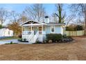 Beautiful exterior of this charming home highlighting the freshly landscaped yard and covered front porch at 1020 Pinedale Se Dr, Smyrna, GA 30080