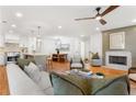 Spacious living room flows into the kitchen and dining areas, featuring hardwood floors and modern decor at 1020 Pinedale Se Dr, Smyrna, GA 30080