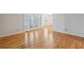 Spacious living room featuring gleaming hardwood floors and lots of natural light at 1445 Monroe Ne Dr # 14F, Atlanta, GA 30324