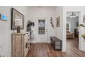 Bright entryway with hardwood floors, stylish decor, and a view into the living spaces at 2638 Songbird Ln, Grayson, GA 30017