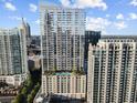 Modern high-rise building showcasing upscale architectural design and a pool deck amenity at 855 Peachtree Ne St # 1906, Atlanta, GA 30308