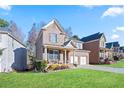 Beautiful two-story home with a well-maintained lawn, showcasing its inviting curb appeal at 2591 Royston Dr, Duluth, GA 30097