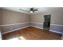 Inviting living room with hardwood floors, neutral paint, and classic trim detail at 781 E Glochester Pl, Norcross, GA 30071