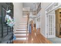 Welcoming foyer with hardwood floors, a staircase, and an open view to the upper level at 1463 Bailey Farm Sw Dr, Marietta, GA 30064