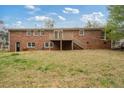 Spacious backyard with a wooden deck and stair access to the yard from the second story at 3355 Lauada Dr, Douglasville, GA 30135