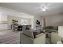 Inviting living room with neutral walls, wood floors, and an open dining area at 3355 Lauada Dr, Douglasville, GA 30135