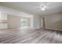 Bright open living room with wood floors and views into the dining area and kitchen at 3355 Lauada Dr, Douglasville, GA 30135