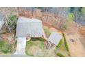 Expansive aerial view of the property, showcasing a well-maintained home, lush greenery, and a long driveway at 5995 Lanier Heights Cir, Buford, GA 30518