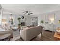 Cozy living room boasts a stone fireplace, neutral tones and lots of natural light at 3171 Jessica Dr, Douglasville, GA 30135