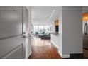 Inviting entryway leading to a sunlit living space with hardwood floors and a glimpse of the modern kitchen at 3338 Peachtree Ne Rd # 3406, Atlanta, GA 30326