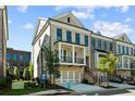 Beautiful brick townhome with a balcony, private entrance, and manicured landscaping at 235 Briscoe Way # 7, Alpharetta, GA 30009
