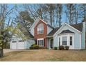 Inviting two-story home with a well-manicured lawn, light blue siding, and brick facade at 2770 Da Vinci Cres, Decatur, GA 30034