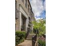 Brick townhome with manicured landscaping and inviting entrance at 45 Honour Nw Ave, Atlanta, GA 30305