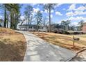 Inviting white brick home with a long driveway and charming exterior at 1937 Joseph Ct, Decatur, GA 30032
