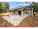 View of backyard concrete patio, offering space for outdoor seating and entertaining at 2279 Perch Sw Way, Marietta, GA 30008
