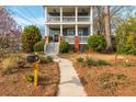 Beautiful two-story home with a front yard and mailbox leading to a front porch at 243 Sterling St, Decatur, GA 30030