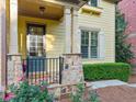 Charming front porch with stone accents, wrought iron railing, and professionally landscaped garden at 232 Hunt Ne St, Marietta, GA 30060