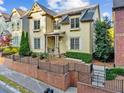 Attractive two-story home with professionally landscaped front yard and brick accent wall at 232 Hunt Ne St, Marietta, GA 30060
