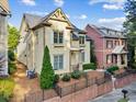 Charming two-story home with manicured landscaping, fenced yard, and inviting curb appeal at 232 Hunt Ne St, Marietta, GA 30060