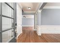 Elegant foyer with hardwood floors, wainscoting, and neutral paint at 232 Hunt Ne St, Marietta, GA 30060