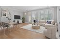 Bright living room with large windows, hardwood floors, comfortable seating, and a dining area at 281 15Th Ne St # 101, Atlanta, GA 30309