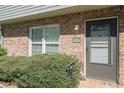 Charming front entrance with neatly trimmed bushes and visible house number at 1143 Forest Villa Nw Dr, Conyers, GA 30012