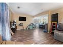 Open living space with neutral walls, laminate flooring and a modern ceiling at 1143 Forest Villa Nw Dr, Conyers, GA 30012