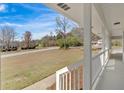 Covered front porch features white columns and railings, offering a serene outdoor space at 3679 Mill Glen Dr, Douglasville, GA 30135