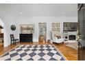 Foyer with hardwood floors, a checkerboard rug, and views to the living room and a hallway at 5 Arc Ne Way, Atlanta, GA 30305