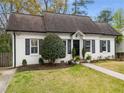 Charming home with a well-manicured lawn, and nicely trimmed bushes and landscaping at 5 Arc Ne Way, Atlanta, GA 30305