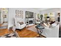 Cozy living room with hardwood floors, fireplace, and stylish furniture for comfortable living at 5 Arc Ne Way, Atlanta, GA 30305